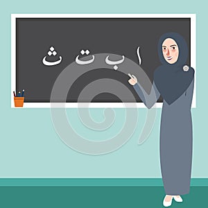 Teacher female standing in front of class explain Arabic alphabet learn Islam scripture