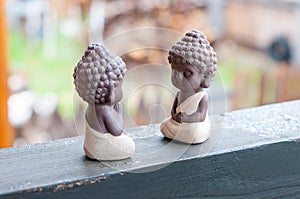 Teacher and follower or pupil ceramic little buddha. Buddhism, Yoga, meditation concept