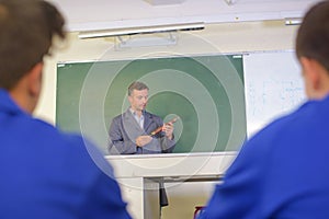Teacher in front blackboard
