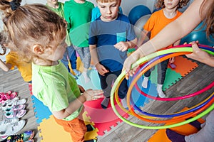 Teacher gives hula-hoops to group of impatient ids