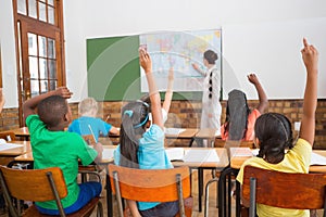 Teacher giving a geography lesson in classroom