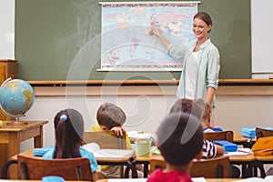 Teacher giving a geography lesson in classroom