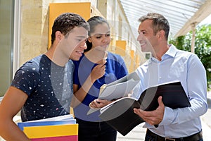 Teacher with group student outdoors