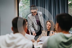 Teacher guiding students in classroom during group study session