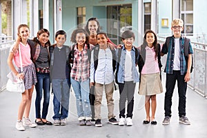 Teacher hanging out with group of elementary kids at school