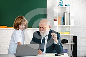 Teacher help to learn. Happy lessons. Back to school. Education and learning. Pupil and teacher with laptop. Teacher