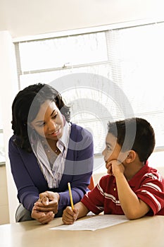 Teacher Helping Boy With Schoolwork