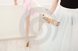 Teacher helping her student during dance class