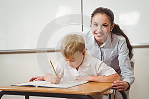 Teacher helping a student in class