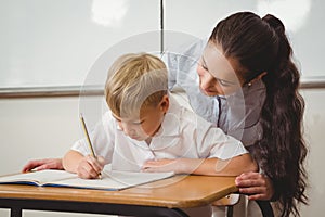 Teacher helping a student in class