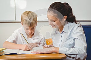 Teacher helping a student in class