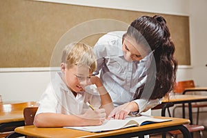 Teacher helping a student in class