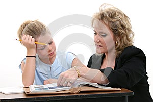 Teacher Helping Student at Desk
