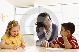 Teacher Helping Students With Schoolwork photo