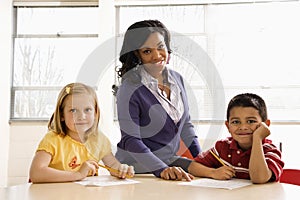 Teacher Helping Students With Schoolwork photo