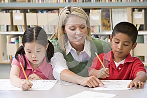 Teacher helping students with writing skills