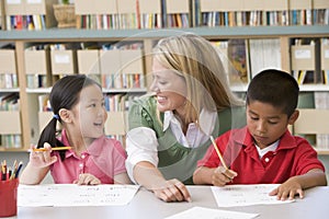 Teacher helping students with writing skills