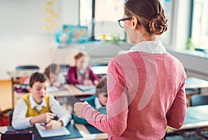 Teacher with her students in class at elementary school