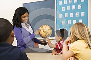 Teacher Holding Globe