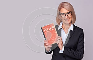 Teacher holds a English textbook