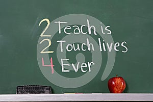 Teacher inspirational phrase on chalkboard photo