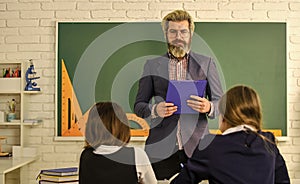 Teacher and kids Classroom. Discussion group of children and teacher. Dialogue and communication. Daily school life