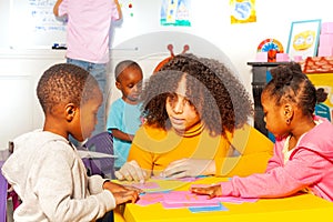 Teacher and kids cursive alphabet, nursery school photo