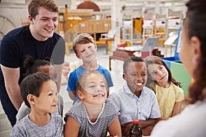 Teacher and kids having fun at a science centre