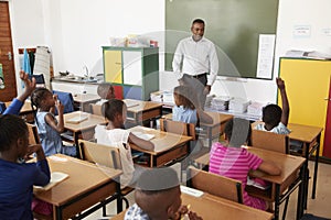 Teacher and kids during a lesson at an elementary school