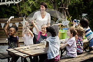 Teacher and kids school learning ecology gardening