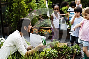 Teacher and kids school learning ecology gardening