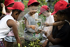 Teacher and kids school learning ecology gardening