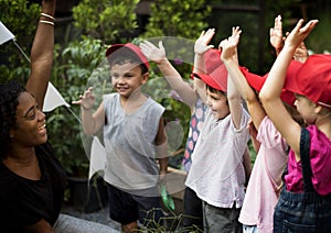 Teacher and kids school learning ecology gardening