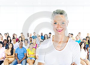 Teacher and Large Group of Student in Lecture Room