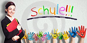 Teacher and many painted kids hands with smileys and the message