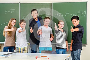 Teacher motivating students in school class