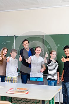 Teacher motivating students in school class