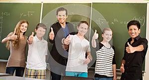 Teacher motivating students in school class