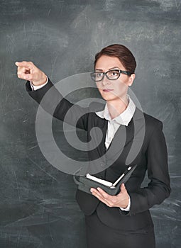 Teacher with organizer pointing on someone