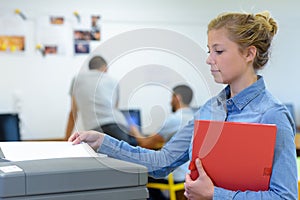 teacher printing off work sheets for next lesson