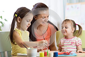 Teacher and pupils in the art workshop