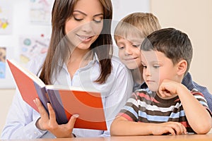 Teacher reading a book.