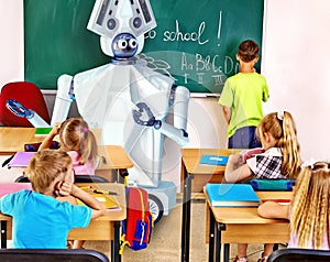 Teacher robot with school children in school class near blackboard.