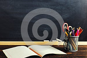 The teacher`s desk or a worker, on which the writing materials lie and books. Blank for text or background for a school theme.