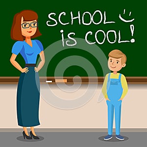 Teacher and schoolboy writing on chalk board. Back to school.