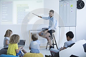 Teacher shows on an interactive whiteboard