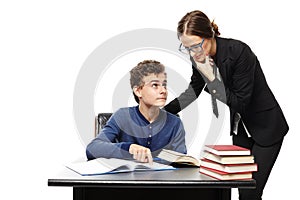 Teacher standing next to the student's desk and the student poi