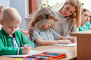 Teacher and student in the classroom during the first maths lesson