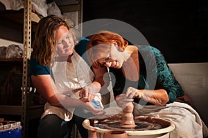 Teacher and student in clay studio