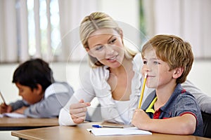 Teacher, student and help, study and education in class, question and think of answer for school work and knowledge
